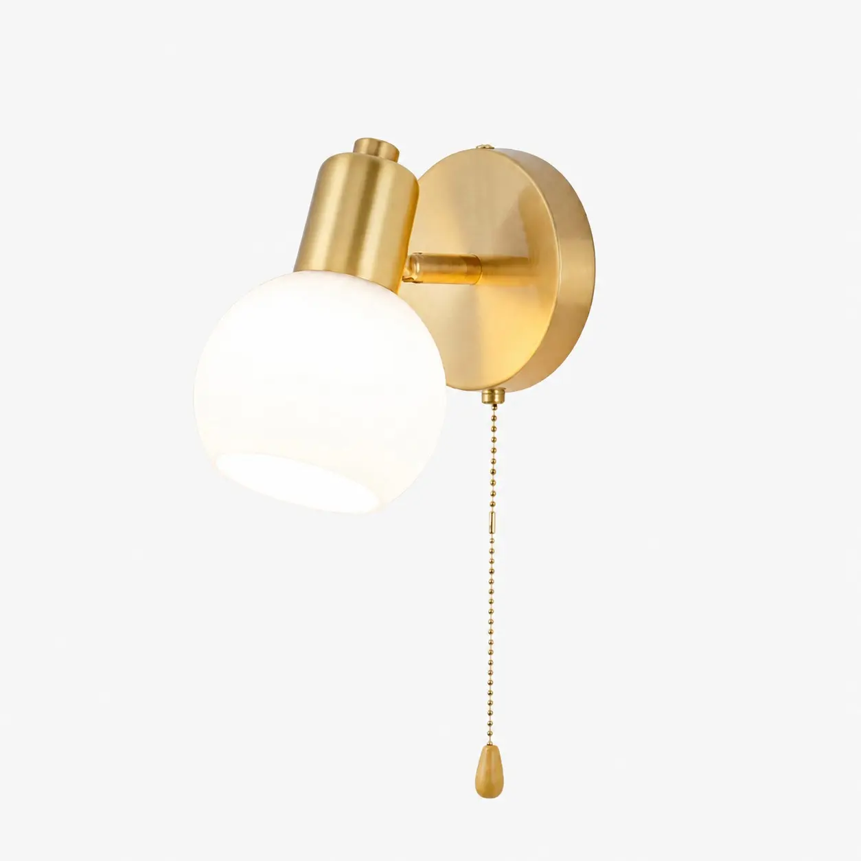 Gold brass single-light wall sconce with pull chain